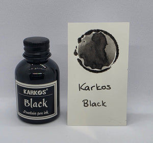 Karkos Black ink bottle with a written swatch