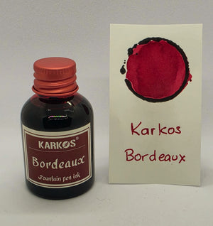 Karkos Bordeaux ink bottle with a written swatch
