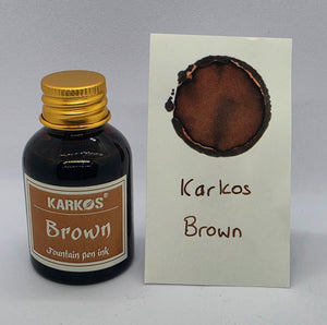 Karkos Brown ink bottle with a written swatch