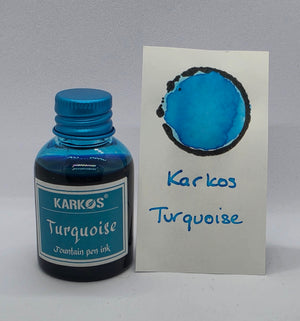Karkos Turquoise ink bottle with a written swatch