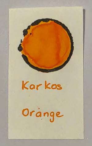 Karkos Orange ink written swatch on paper